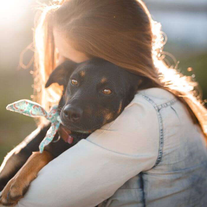 Girl Hugging her dog